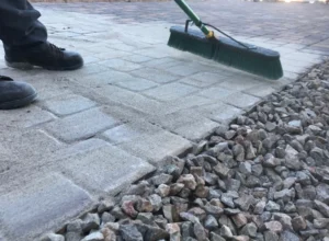 worker doing paver sealing service